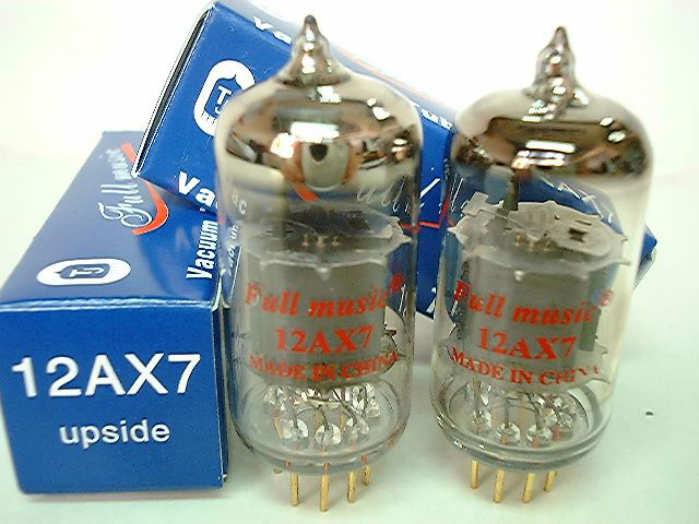 Photo of two ECC83/12AX7 High-MU A.F. Double Triodes shown with packaging boxes